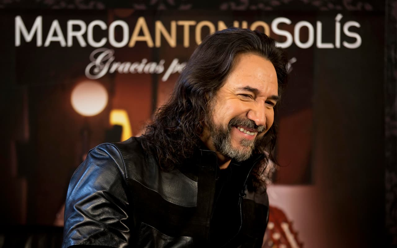 Mexican singer Marco Antonio Solis, "el Buki," smiles during an interview promoting his new album, "Gracias Por Estar Aqui," in Mexico City, Tuesday, Oct. 22, 2013. (AP Photo/Eduardo Verdugo)
