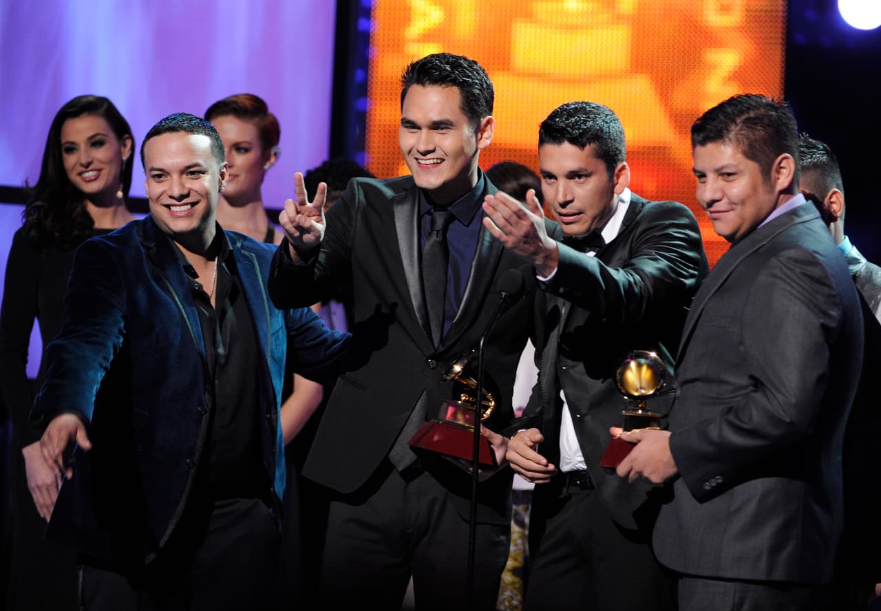 Banda Los Recoditos accept the award for best banda album for "El Free" at the 14th Annual Latin Grammy Awards at the Mandalay Bay Hotel and Casino on Thursday, Nov. 21, 2013, in Las Vegas. (Photo by Chris Pizzello/Invision/AP)