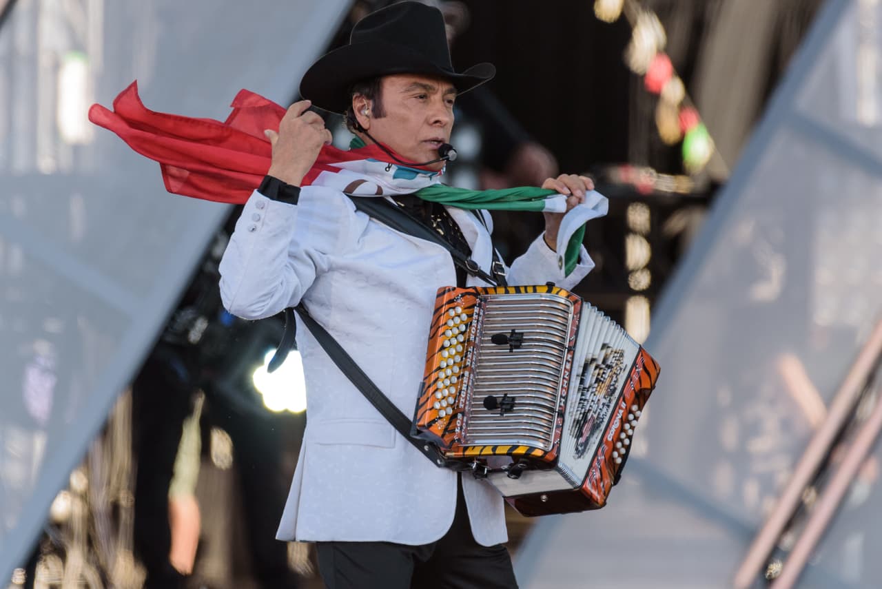Jorge Hernández of Los Tigres del Norte performs at RiseUp As One at Cross Border Xpress on Saturday, Oct. 15, 2016, in San Diego, Calif. (Photo by Alan Hess/Invision/AP)