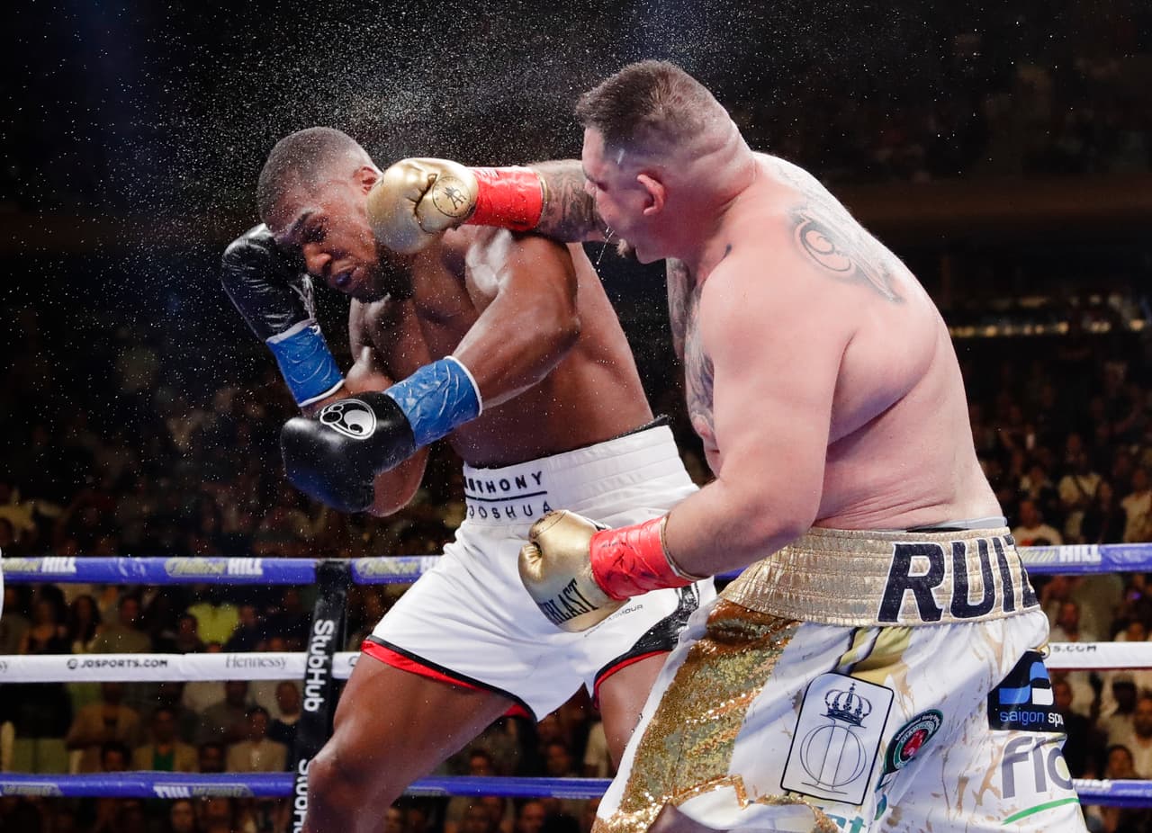 Andy Ruiz, right, punches Anthony Joshua during the seventh round of a heavyweight championship boxing match Saturday, June 1, 2019, in New York. Ruiz won in the seventh round. (AP Photo/Frank Franklin II)