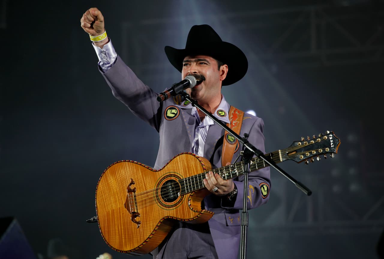 FILE - In this May 16, 2010 file photo, Mario Quintero, member of the Mexican music band Los Tucanes de Tijuana, performs during the "Vive Grupero" Mexican folk music festival in Mexico City. Quintero will be honored at the 26th annual BMI Latin Awards with the BMI President’s Award, the biggest honor of the night. The ceremony will be March 19, 2019 in Beverly Hills, California. (AP Photo/Eduardo Verdugo,File)