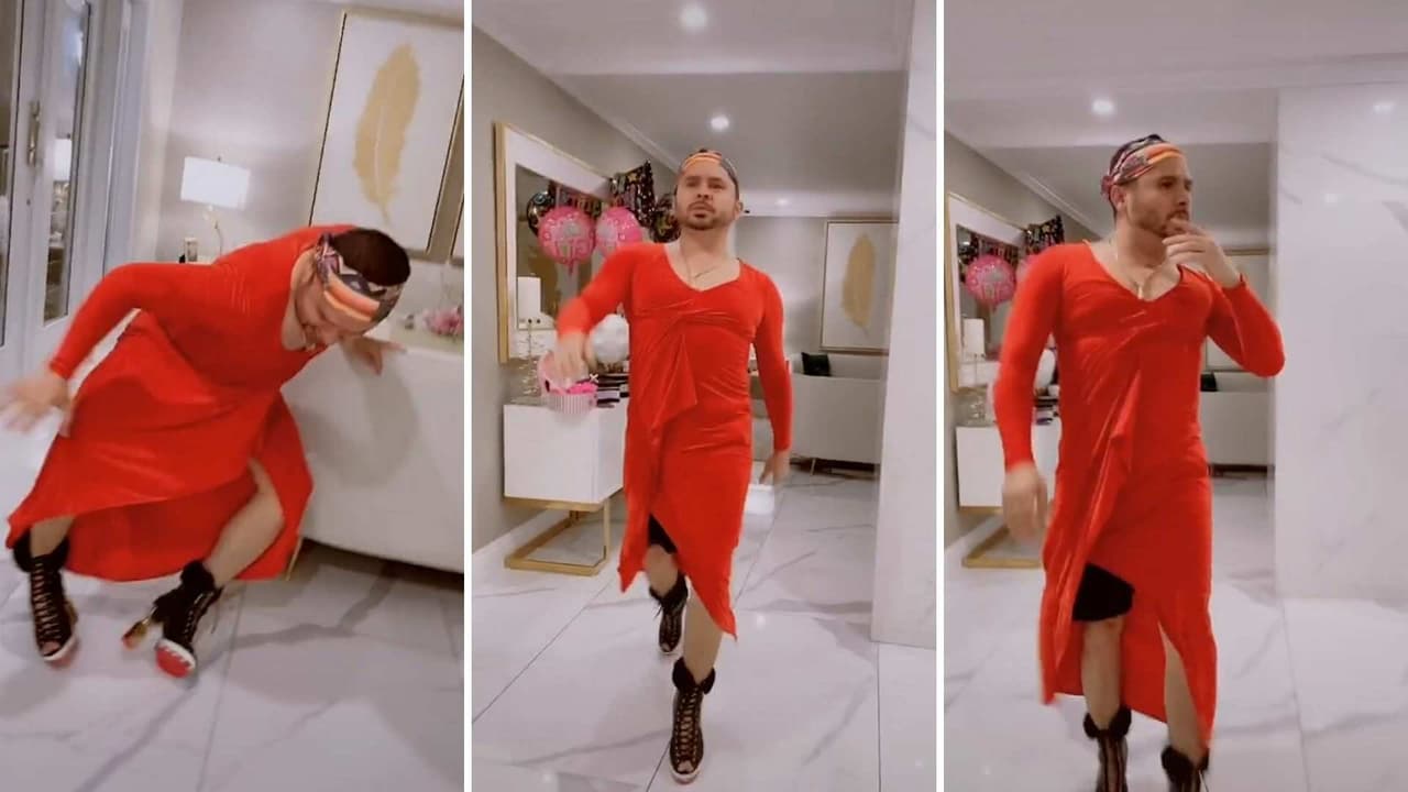 Larry Hernández hace pasarela en tacones altos y sexy vestido rojo