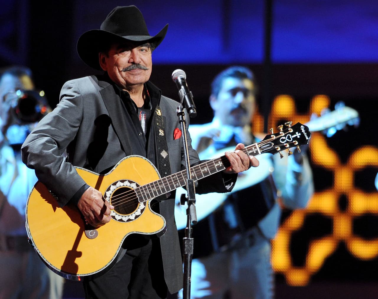 FILE - In this Nov. 15, 2012, file photo, Joan Sebastian performs at the 13th Annual Latin Grammy Awards at Mandalay Bay in Las Vegas. The Mexican Television chain Televisa announced on Monday, July 13, 2015, that Sebastian has died after a long battle with cancer. (Photo by Al Powers/Powers Imagery/Invision/AP, File)