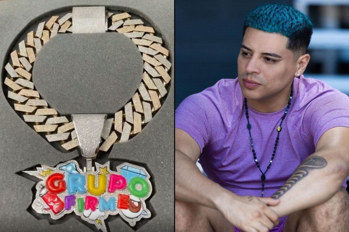 Eduin Caz tiene un collar de oro con el logo de Grupo Firme, cubierto de diamantes.